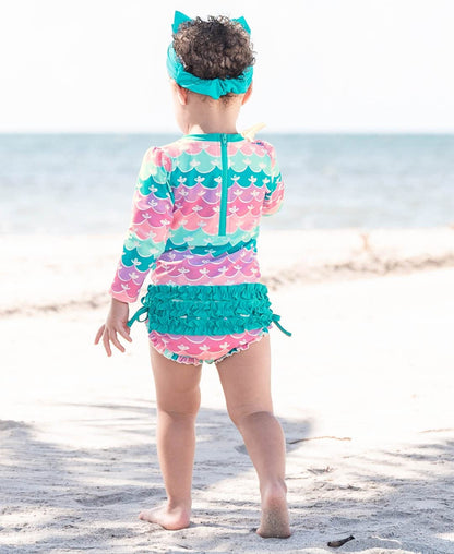 RuffleButts Baby Girls UPF 50+ Sun Protection Novelty Print Long Sleeve One Piece Rash Guard Swimsuit with Zipper - Mermaid/Aqua, 18-24m